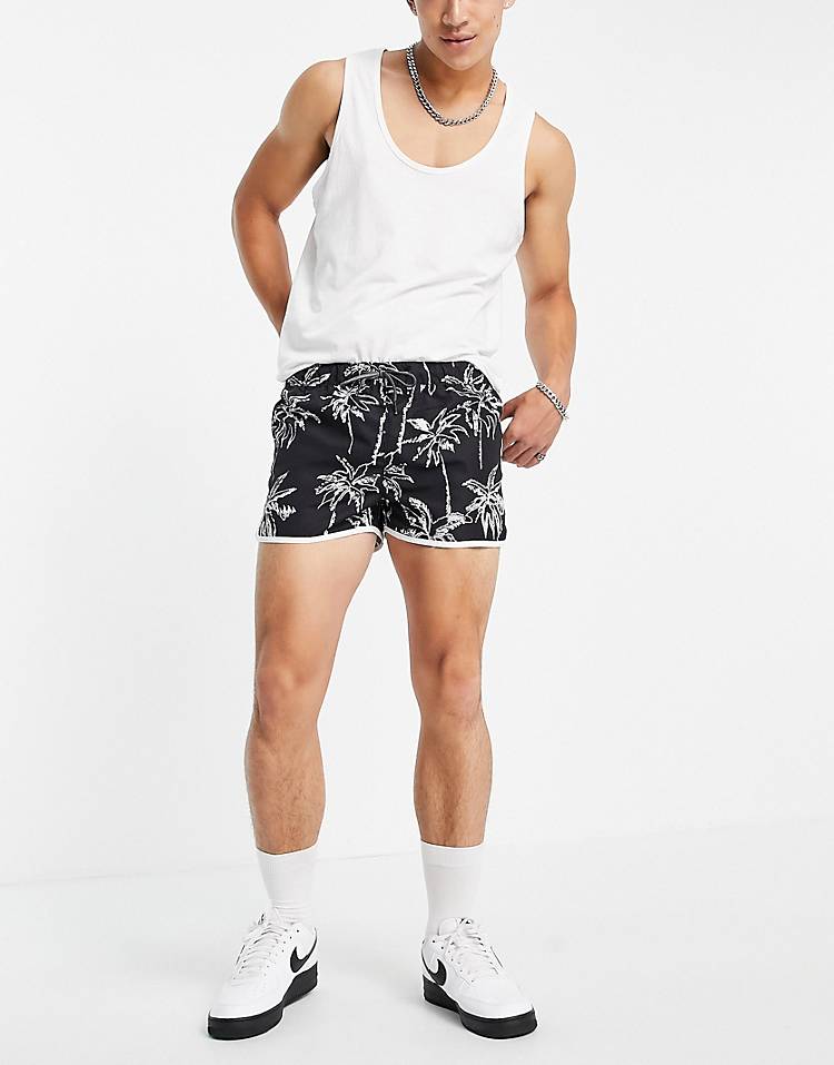 Jack & Jones Intelligence racer swim shorts in black palm print